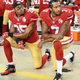 Eric Reid, No. 35, and Colin Kaepernick, No. 7, of the San Francisco 49ers kneel in protest during the national anthem prior to playing the Los Angeles Rams at Levi’s Stadium on Sept. 12, 2016, in Santa Clara, Calif. (Thearon W. Henderson/Getty Images)